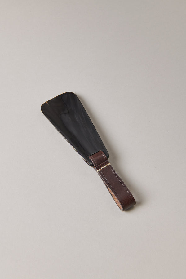 Small shoehorn with strap